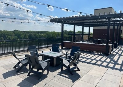 Another view of the 85 at Midland Terrace rooftop patio with fire pit gathering