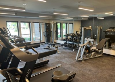 Another view of the state of the art work out room at 85 at Midland Terrace complete with weight lifting gear